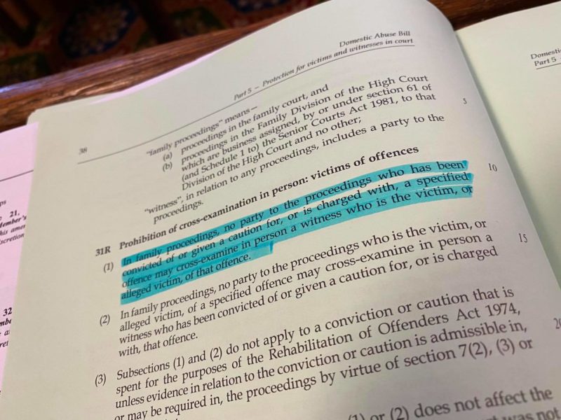A photo of the Domestic Abuse Bill with the paragraph on the prohibition on Cross-examination in family courts highlighted.