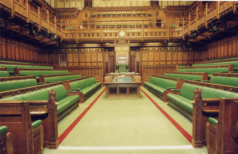 A picture of the House of Commons Chamber empty.