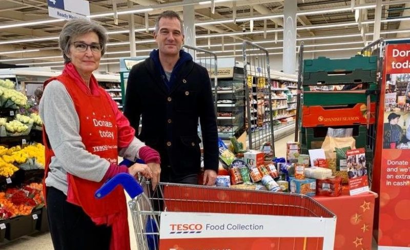 Peter Kyle joins volunteers and staff collecting donations for local food banks. 